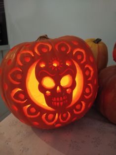 a carved pumpkin with a skull on it