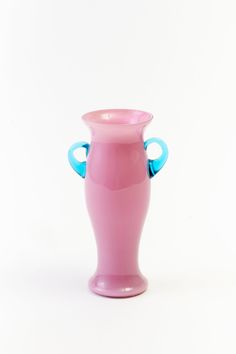 Vintage pink glass vase with blue handles. Parlor Games, Entry Hall, Glass Vases, Vintage Vases, Linen Pillows, Cocktail Napkins, Vintage Beauty, Hostess Gifts, Corporate Gifts