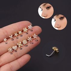 four pairs of nose piercings with flowers and hearts on each side, in gold