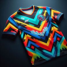 a colorful t - shirt on a black surface