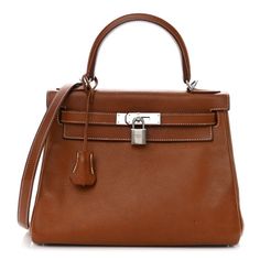 This is an authentic HERMES Barenia Faubourg Kelly Retourne 28 in Fauve. This stylish tote is crafted of beautiful Barenia Faubourg calfskin leather in golden brown. The bag features a reinforced leather top handle with polished silver links, an optional shoulder strap, a cross-over flap, strap closure, and a signature Kelly turn lock. This opens to a matching leather interior with zipper and patch pockets. Brown Epsom Leather Shoulder Bag With Gold-tone Hardware, Brown Epsom Leather Bag With Gold-tone Hardware, Luxury Brown Epsom Leather Bag, Luxury Brown Epsom Leather Shoulder Bag, Brown Epsom Leather Bag With Handles, Brown Epsom Leather Bag, Luxury Brown Bag With Silver-tone Hardware, Luxury Brown Bags With Silver-tone Hardware, Timeless Brown Epsom Leather Bag