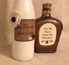 a bottle that has some kind of label on it, next to another bottle with the message you'll be my glass of wine