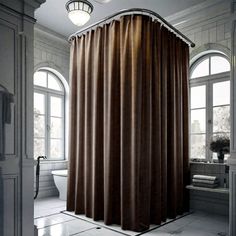 a bathroom with a large shower curtain next to a bathtub and window sill