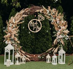 a wedding arch decorated with flowers and candles