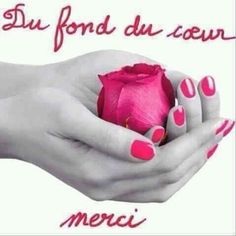 a woman's hands holding a pink rose with french writing on the bottom and below it