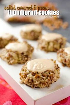 some cookies are sitting on a white tray