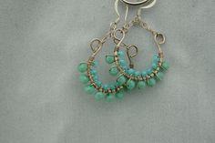 This is the perfect option for those who like cool, unique jewelry and the luxury, shine of sterling silver, turquoise. These earrings is well made, cute and/or elegant in design, and very desirable. The earrings have a drop part. The drop part has the shape of the semicircle on chains. The earrings are decorated with balls from turquoise. The clasp is in very good working condition. ♥ Age/Era: Circa before the 2000s. ♥ There is no hallmark, but it is sterling .925.(tested with acid). ♥ The earr Handmade Turquoise Hoop Earrings As Gift, Turquoise Dangle Hoop Earrings For Gift, Unique Handmade Turquoise Hoop Earrings, Turquoise Hoop Earrings As A Gift, Turquoise Hoop Earrings For Gift, Turquoise Hypoallergenic Hoop Earrings As Gift, Hypoallergenic Turquoise Hoop Earrings As Gift, Turquoise Hypoallergenic Hoop Earrings For Gift, Everyday Turquoise Wire Wrapped Jewelry