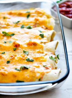 a casserole dish with cheese and herbs