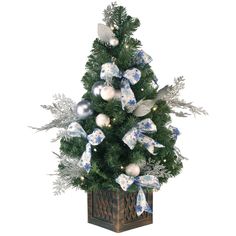 a small christmas tree decorated with blue and white bows, silver ornaments and snowflakes