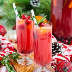 two glasses filled with cranberry punch on top of a table