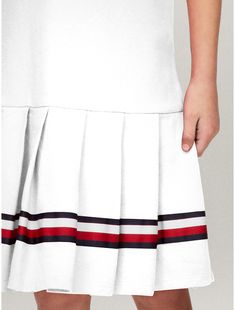 Tommy Hilfiger girls' dress.  Material: 97% Regenerative Cotton, 3% Elastane. White A-line Dress With Pleated Skirt, White Short Sleeve Dress With Pleated Hem, White Mini Dress With Pleated Hem, Casual White Dress With Pleated Hem, White Cotton Tommy Hilfiger Dress, Cotton Mini Dress With Pleated Skirt, Cotton Pleated Mini Dress, Casual White Dress With Pleated Skirt, White Tommy Hilfiger Summer Dress