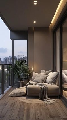 a living room filled with lots of furniture next to a balcony overlooking the cityscape