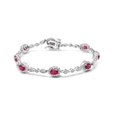 Behold this stunning link bracelet, fit for a queen. Crafted from lustrous 10K white gold, it features eight natural heat treated red rubies, each elegantly cut into an oval shape measuring 4.5mm x 3mm. The rubies are perfectly complemented by eight sparkling round diamonds with a total weight of 0.05 cttw. These diamonds, with their H-I color and SI1-SI2 clarity, are set in prongs to ensure maximum brilliance and fire. This exquisite bracelet measures 7 inches in length and is designed to fit s Elegant Red Chain Bracelet With Jubilee Design, Elegant Red Jubilee Chain Bracelet, Elegant Red Diamond Bracelets, Classic Red Diamond Bracelets, Elegant Red Oval Diamond Bracelet, Elegant Red Jubilee Bracelet, Classic Red Jubilee Bracelet, White Gold Ruby Gemstone Bracelet, Elegant Red Sterling Silver Round Bracelet