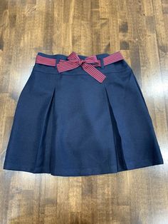 Nautica School Uniform Girls Navy Pleated Skirt/Skort w/ Red Bow Belt Size 14. Excellent skirt with built in under shorts and removable ribbon belt. Sales tag is missing. Navy Pleated Skirt, Navy Ribbon, Under Shorts, Bow Belt, Ribbon Belt, School Uniforms, Skirt Belt, Skirt Design, Red Bow