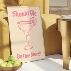 a sign that says should we do one more? with apples in a bowl next to it