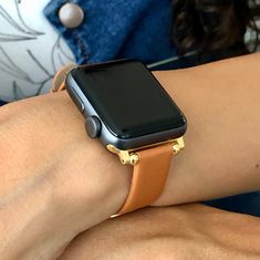 14mm Slim Brown Apple Watch Bracelet iWatch Band Women,  Eco-Friendly Sustainable Leather Apple Watch Strap With Gold Accents Gorgeous Design Slim Leather Jewelry Tailored to Perfection. Designed And Handmade by Simeon D Jewelry Studio. This Bracelet Fits ALL Apple Watch Series. Adjustable Bracelet  5.5" - 7.5" Wrist Size. Not For Other Models. Apple Watch Is NOT Included. Let's be Friends! Follow my Studio on Social Media. Instagram @simeondjewelry Pinterest @simeondjewelry Facebook @simeondjew Gold Minimalist Watch Accessories For Everyday, Trendy Gold Watch Accessories For Everyday Use, Trendy Gold Watch Accessories With Leather Strap, Trendy Gold Watch With Leather Strap, Gold Rectangular Leather Strap Apple Watch Band, Gold Rectangular Leather Apple Watch Band, Gold Rectangular Apple Watch Band With Leather Strap, Minimalist Gold Watch Accessories With Bracelet Strap, Gold Minimalist Watch Accessories With Bracelet Strap