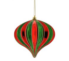 a red and green striped ornament hanging from a gold chain on a white background