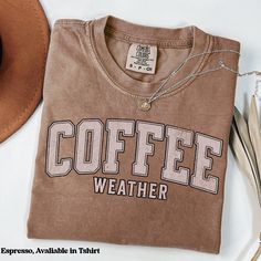 Coffee lovers will love this super cute and preppy collegiate style Comfort Colors®  t-shirt, crewneck sweatshirt, or hoodie that reads "Coffee Weather". With one of these high quality garments, you will want to wear this all fall, winter, or anytime of the year! Because its always coffee season! This is the perfect gift for a coffee lover, barista, girlfriend, wife, bestie, or yourself! Available in a variety of sized and colors. Please note that this listing is for or a Comfort Colors®: Cotton Retro T-shirt For Everyday Fall Wear, Winter College Style T-shirt With Graphic Print, Oversized Fall T-shirt For College, Oversized Fall College Style T-shirt, Oversized College Style T-shirt For Fall, Retro Cotton Sweatshirt For Fall, Collegiate Fall T-shirt With Lettering, College Letter Print T-shirt For Fall, Fall Collegiate T-shirt With Text Print