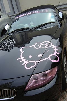 a car with a hello kitty decal on it