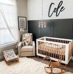 a baby's room with a rocking chair, crib and coffee sign on the wall