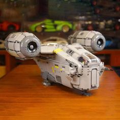 a lego star wars ship from europe sits on a table