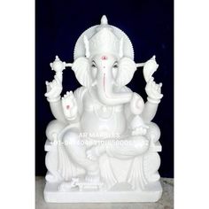 an elephant statue sitting on top of a table