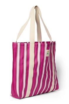 a pink and white striped tote bag on a white background with the handles down