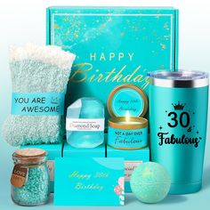 the happy birthday gift set includes a blue cup, candle, and other personal care items