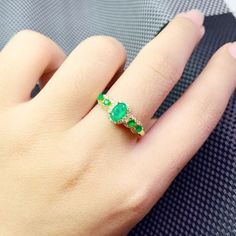 >>>> BASIC INFORMATION <<<< Gemstone: Natural Emerald.Gemstone Origin: Colombia.Natural Stone Size: oval 4 Pcs 2*3mm + oval 1 pc 4*6mm.Side stones: dainty CZ diamond (shining cubic zircon).14k gold plated emerald ring.14k rose gold plated emerald ring925 sterling silver natural emerald ring.>>>> CUSTOM METALS <<<< Ring Size: From US 5 to US 11.Customized Metal: The sell price is defaulted metals are Sterling Silver, Rose Gold Plated in Silver and 1 Green Oval Opal Ring, Green Oval Rings For Promise, Oval Green Gemstone Birthstone Ring, Oval Gold Emerald Ring With Stone Setting, Oval Emerald Ring Fine Jewelry, Oval Emerald Ring With Stone Setting, Oval May Birthstone Ring With Stone Setting, Oval Emerald Ring With Stone Setting For Promise, Anniversary Emerald Rings With Stones