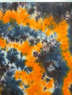 an orange and blue tie - dye pattern is seen in this image from the top view