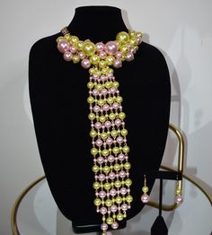 Elegance and style in our Pearl Tie Necklace. Pair with your favorite blouse or Dress. This statement piece does all the talking. Each necklace includes a matching pair of earrings. Elegant Green Bib Necklace For Party, Elegant Multicolor Beaded Necklaces For Party, Elegant Beaded Necklaces, Chic Yellow Jewelry For Party, Pearl Tie, Tie Necklace, Statement Pieces, Pink And Green, Statement Necklace