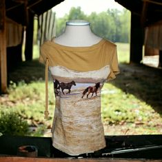 Western Country Cowgirl Aura Wrangler Baby Tee Equestrian Horse Graphics Rope L Aura Is Produced In Greensboro Nc Or It Was 100% Combed Cotton Short Cap Or Baby Style Sleeve, With One Held By A Knotted Rope Meet Aura, Wrangler For Women, Women Who Know How To Kick A**, Know How To Ride And Know They Are The Epitome Of Cowgirl, Even If It's Only At Heart Measurements In Photos Care Tag In Photos Gold, Cream, Brown & Blue Excellent Pre-Owned Condition With No Visible Flaws Nwot, Had A New Sticker Western Style Brown Tops For Ranch, Country Style Tops For Fall Country Events, Cotton Tops With Relaxed Fit For Western-themed Events, Cotton Tops For Rodeo In Summer, Fitted Tops For Western-themed Spring Events, Fitted Western Tops For Rodeo, Country Style Cotton Tops With Relaxed Fit, Western Style Cotton Tops With Relaxed Fit, Casual Brown Tops For Western-themed Events