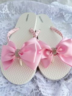 These beautiful flip flops are wrapped in pink satin ribbon, and adorned with a satin ribbon bow and accent with rhinestone strip. Ribbon color is pink  if you are needing other colors of ribbon or decoration please contact me and will be happy to accommodate you! Sizes are for kids and adults. All flip flops are handmade to order and the production time 1 to 2 weeks and then please allow additional time for shipping. Amazing for beach, weddings, flower girl or a fancy event, you choose! Please Rhinestone Wedding Sandals, Handmade Shoes Pattern, Bridesmaid Flip Flops, Ribbon Flip Flops, Fancy Flip Flops, Flip Flop Craft, Decorating Flip Flops, Wedding Flip Flops, Bow Flip Flops