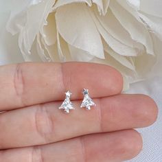 Dainty and delicate small Christmas tree with Cubic Zirconia makes the perfect minimalist accessory for winter season. Earrings are perfect for any age. Metal : 925 Sterling Silver. ( 925 stamped ) Measurements : 6mm x 9mm. Gemstone: Cubic Zirconia. These delicate stud earrings are handcrafted from 925 sterling silver, that doesn't tarnish your ears, hypoallergenic, nickel and lead free. ADD TO YOUR ORDER: 925 Sterling silver butterfly silicone coated backings link:  https://www.etsy.com/listing Earrings Kids, Shamrock Earrings, Small Christmas Tree, Double Earrings, Minimalist Accessories, Tree Earrings, Christmas Tree Earrings, Kids Earrings, Women Earrings