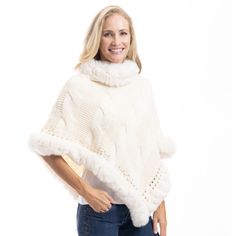 Embrace the ultimate in cozy sophistication with the "Traveler's Luxe" chunky cable knit poncho. Designed with the modern adventurer in mind, this poncho combines style and practicality, making it your perfect companion for on-the-go comfort. The 28" center back length ensures easy mobility while enveloping you in warmth, like a blanket you can wear. The luxurious faux fur trim adds a touch of elegance, elevating the poncho’s chunky cable knit design. Crafted from 100% polyester, this piece offe One Size Blush, Travel Chic, Poncho Jacket, Cozy Coats, Knit Poncho, Chunky Cable Knit, Poncho Style, Knitted Poncho, Vest Outfits