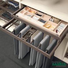 the drawers are open and neatly organized in this kitchen cabinet drawer organization system, which is also used to store folded linens