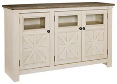 a white cabinet with glass doors and wood top