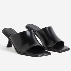 Mules In Coated Fabric With Square Toes, A Wide Foot Strap, And Comma Heels. Satin Lining. Heel Height: High Heel Footwear Type: Mules Description: Black, Solid-Color Lining: Polyurethane 100% Upper: Polyurethane 100% Sole: Polyurethane 51%, Thermoplastic Polyurethane 49% Sleek Fitted Heels For Summer, Black Heels For Workwear In Summer, Black Heels For Summer Workwear, H&m Heels For Spring Party, Classic Heels For Summer Workwear, Classic Summer Heels For Workwear, Classic Summer Heels For Work, Classic Summer Workwear Heels, Elegant H&m Heels For Spring