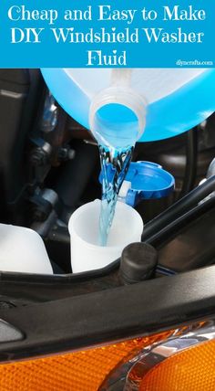 a close up of a car's engine with water pouring out of the tank