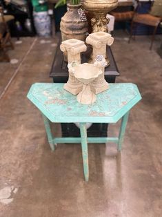 three vases sitting on top of a small table