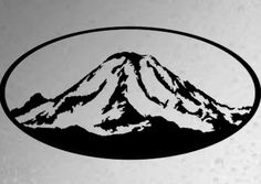 a black and white photo of a mountain with snow on it's peak in a circle