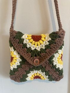 a crocheted purse hanging on the wall