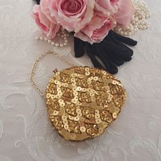 "Hand made vintage gold evening bag with golden beads & golden sequins. Gold-tone chain wrist strap. Small golden beads in a diamond pattern with smaller golden sequins in the diamond shapes and larger golden sequins between the diamonds. Tuck the gold-tone metal chain inside and convert to an evening clutch! Kiss lock at the top with two rhinestones. Gold tone metal bracket. Lined with yellow sateen and a handy pocket on one side. A small evening bag that hangs from the wrist or fingertips or c Gold Evening Bag, Bubble Paper, Golden Beads, Beaded Bag, Small Clutch, Beaded Purses, Gold Sequins, Play Dress, Canada Post