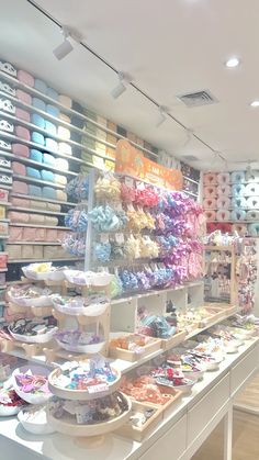 a store filled with lots of different types of cakes and cupcakes on display