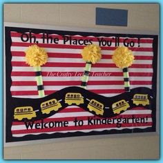 a bulletin board with school buses and flowers on it