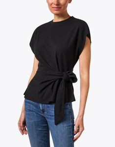 The Nina top from Apiece Apart epitomizes the line's dedication to effortlessly sophisticated dressing. The sleek black silhouette is cut from 100% cotton for ultimate comfort, cinching at the waist with a self-tie waist for a flattering fit every time. Style with your favorite jeans for a versatile look you can wear anywhere. Versatile Tops With Tie Waist For Work, Versatile Tie Waist Tops For Work, Versatile Workwear Tops With Tie Waist, Black Summer Tops With Tie Waist, Cotton Tie Waist Tops For Daywear, Versatile Black Tops For Daywear, Fitted Black Top With Tie Waist, Black Tie Waist Top For Spring, Skirt And Top Dress