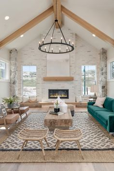 a living room filled with furniture and a fire place in the middle of a room