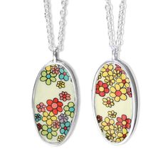 This gorgeous double sided pendant is just dripping with flowers. One side has multicolored rainbow flowers and the other has red and yellow flowers. It measures about 1.25 inches tall and hangs from an adjustable sterling silver chain that can be clasped anywhere between 16 and 20 inches.  Each piece is cast in solid sterling silver and enameled in my Oakland, California studio. I apply custom screen prints made from my drawings to the surface. Durable, beautiful and unique! Jewelry is shipped Red And Yellow Flowers, Oakland California, Cute Gift Boxes, Hippie Necklace, Dog Jewelry, Sterling Pendant, Anniversary Jewelry, Rainbow Flowers, Enamel Jewelry