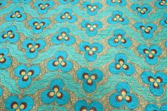 a blue and brown flower pattern on fabric