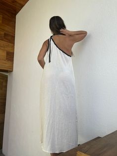 "ALLE BOHO \"GRECIA\" Beach One Shoulder Maxi Dress, features a one-shoulder dress with cotton braid adorning it, wear it as a bikini cover-up, or for a evening event, the fabric is very light and comfortable. This maxi dress is everything that you want for your next vacation. We are so proud to make Artisanal Clothing using only RAW Cotton that feels and looks very basic and natural. Our clothes do not only look natural and beautiful, but they are also made in the most natural and beautiful way Summer One-shoulder Cotton Dress, One Shoulder Maxi Dress For Beach, White Off-shoulder Sundress Maxi Dress, Summer White One-shoulder Maxi Dress, Summer Beach Dress With One Shoulder And Asymmetrical Neckline, Summer Cotton Dress With Asymmetrical Neckline, Beach One-shoulder Maxi Dress, Cotton One-shoulder Dress For Vacation, Cotton Summer Dress With Asymmetrical Neckline